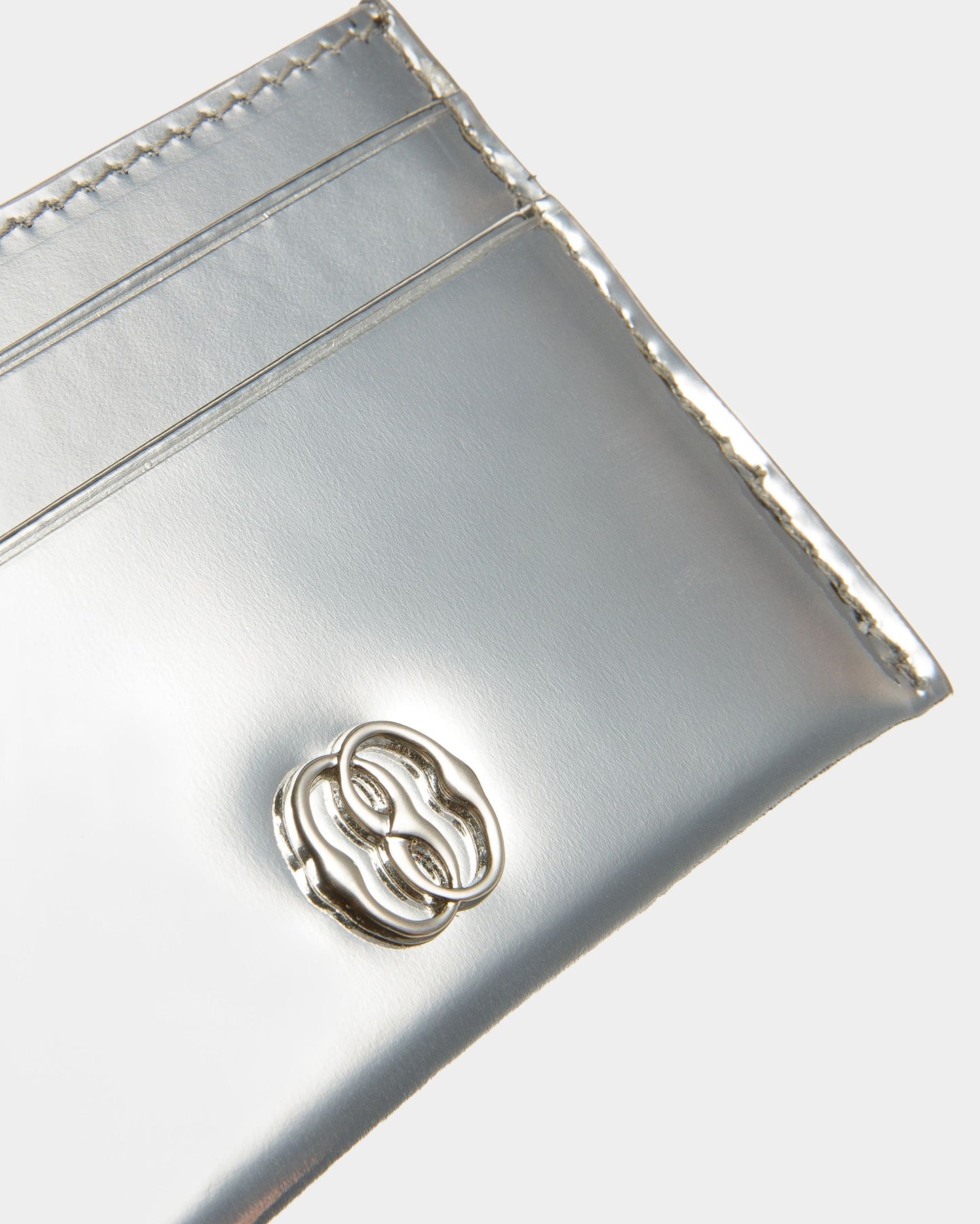 Emblem | Women's Business Card Holder | Silver Leather | Bally | Still Life Detail
