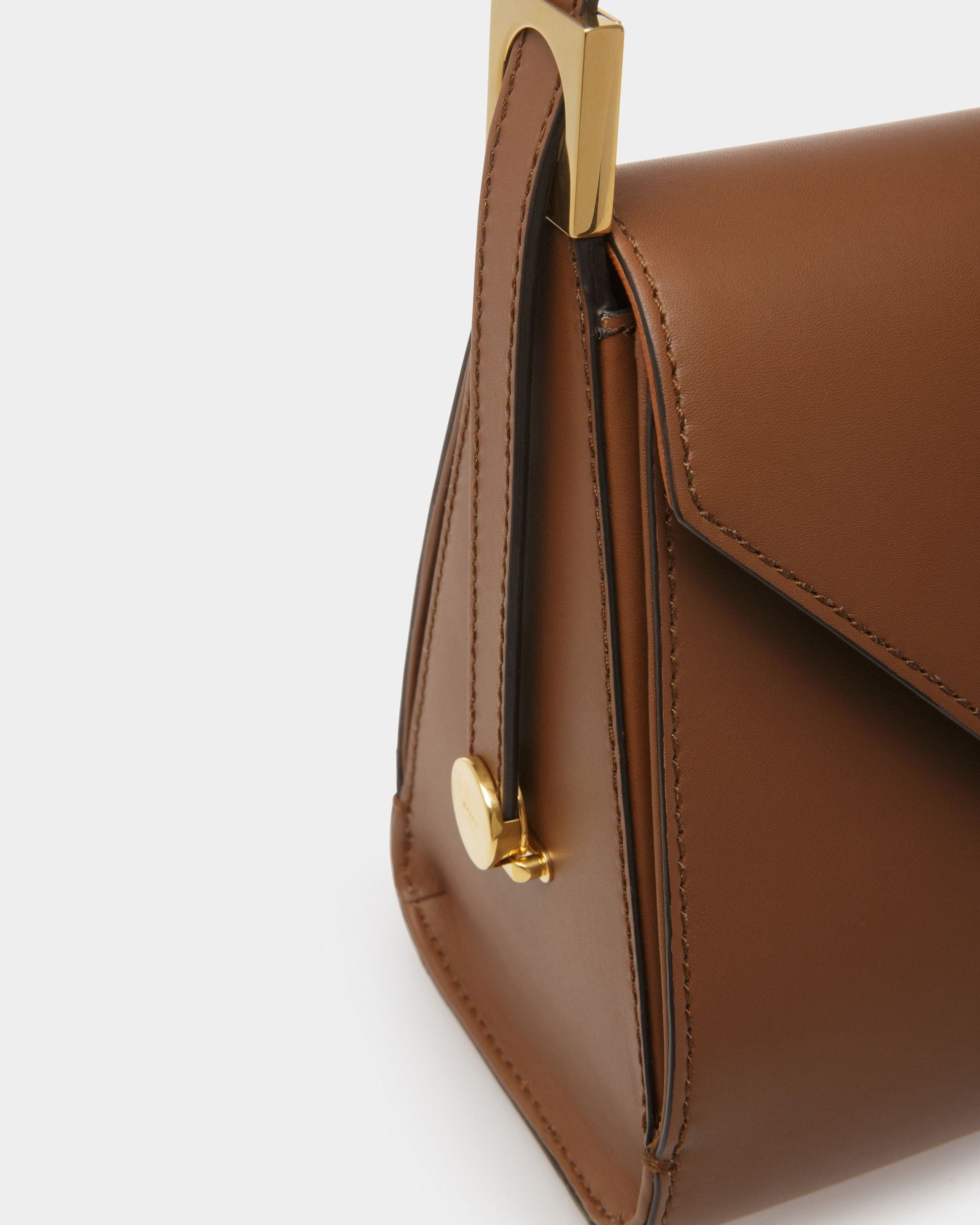 Emblem Trapeze | Women's Top Handle Purse | Brown Leather | Bally | Still Life Detail
