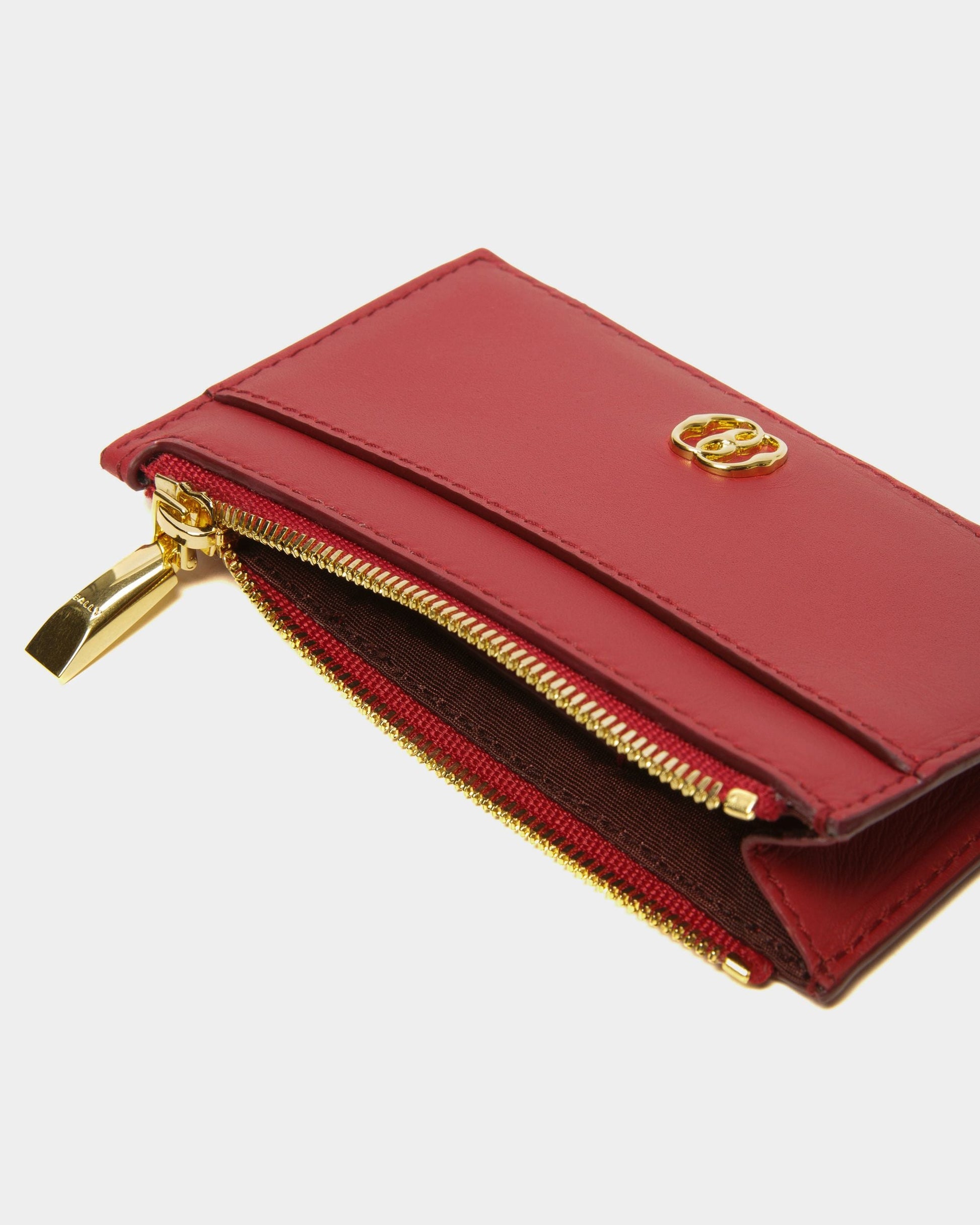 Emblem Zipped | Women's Business Card Holder | Deep Ruby Leather | Bally | Still Life Detail